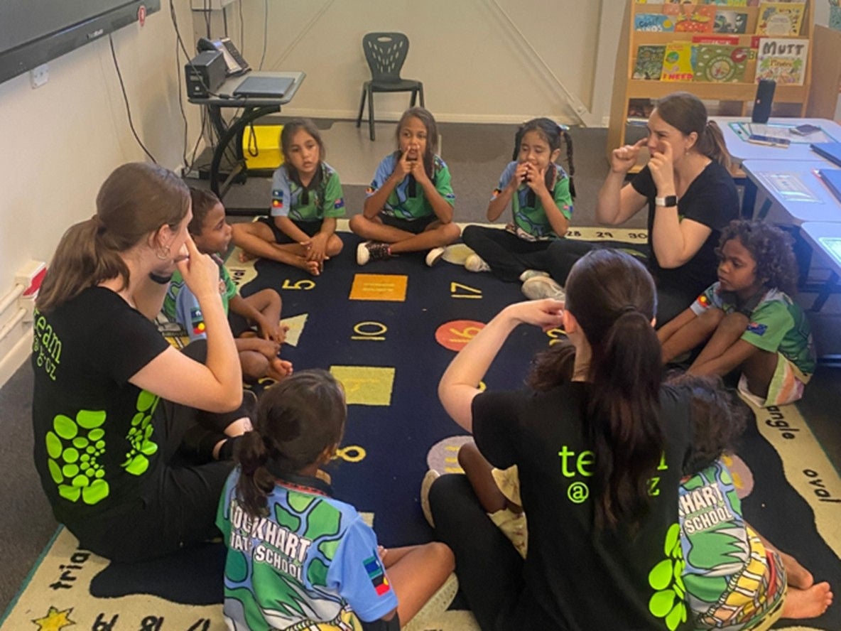 Girls from Oz participating in an activity.